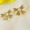 BOW WITH PEARL AND AD EARRING